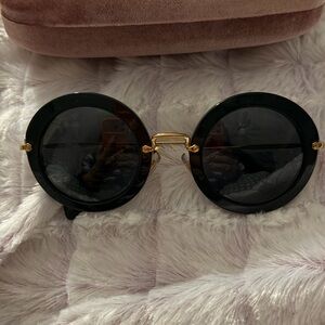 Miu Miu Black and Gold Round Sunglasses